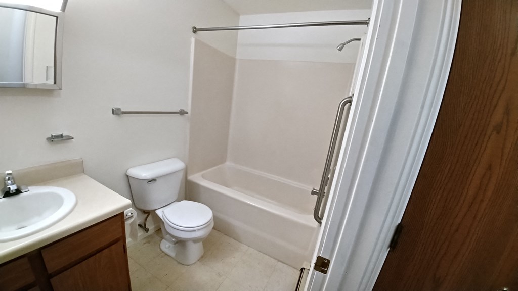 a bathroom with a toilet sink and bathtub