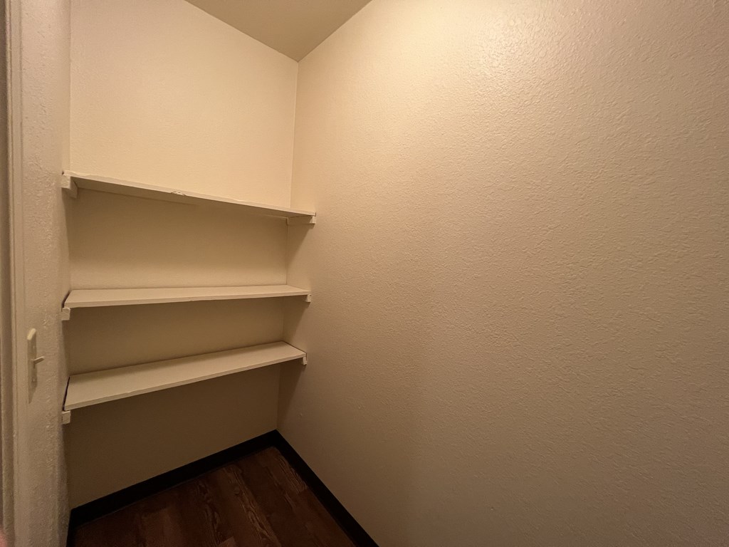 a walk in closet in a 555 waverly unit