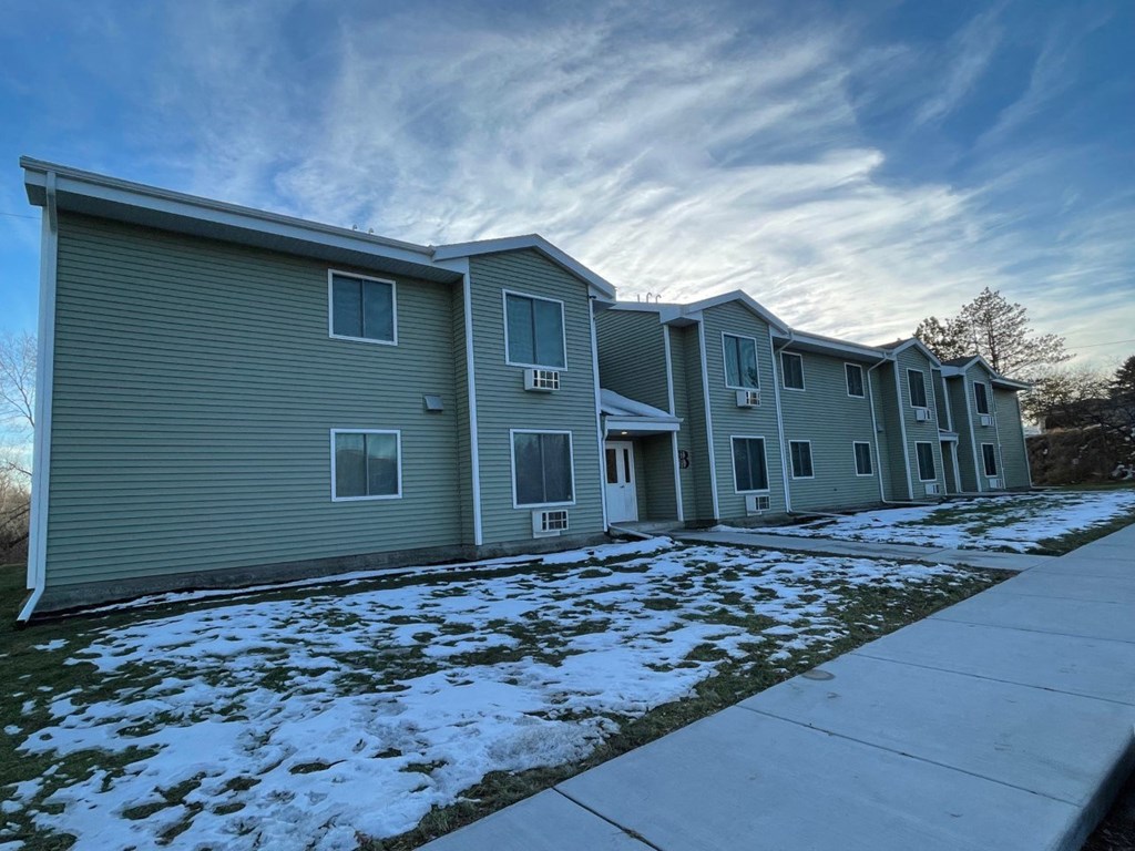 an image of an apartment building in the snow