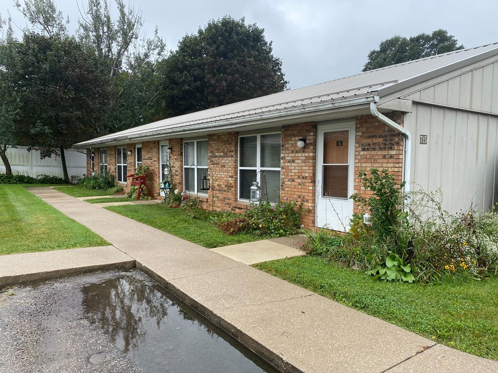 a building with a pond in front of it