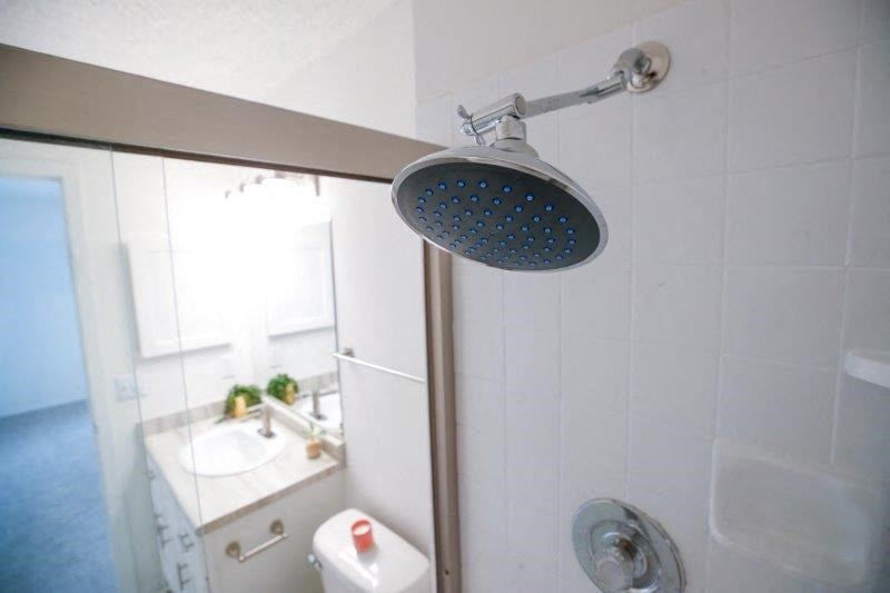 a bathroom with a shower and a sink