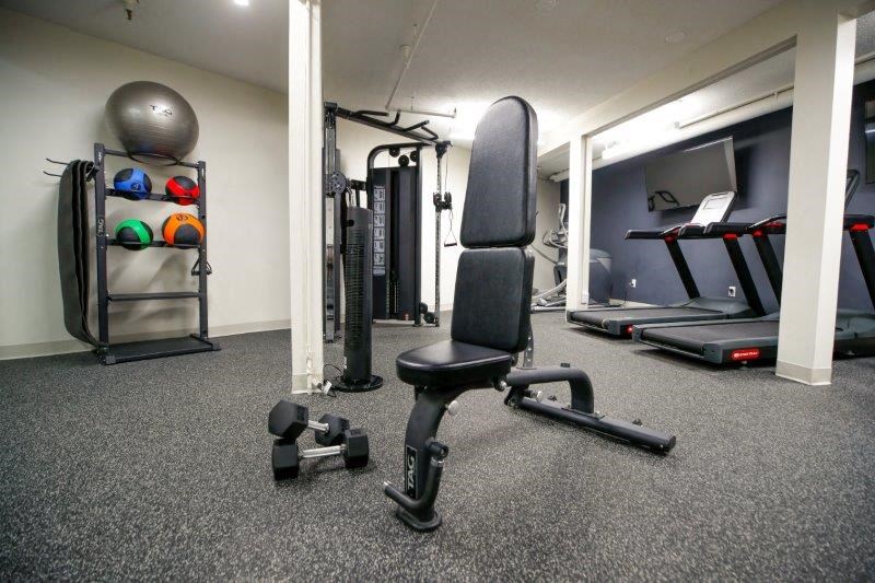 a gym with a lot of equipment in it