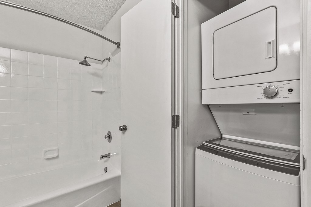 a laundry room with a washer and dryer