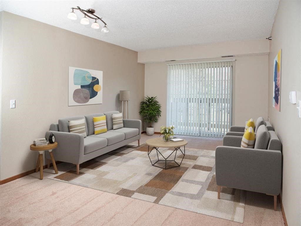 a living room with couches and a coffee table