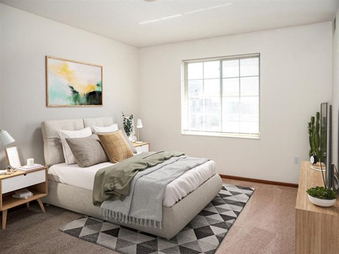 a bedroom with a bed and a window