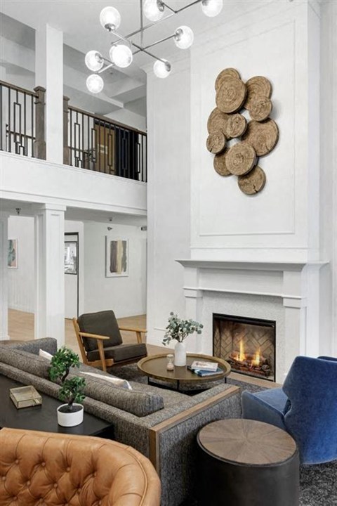 a living room with a fireplace and furniture