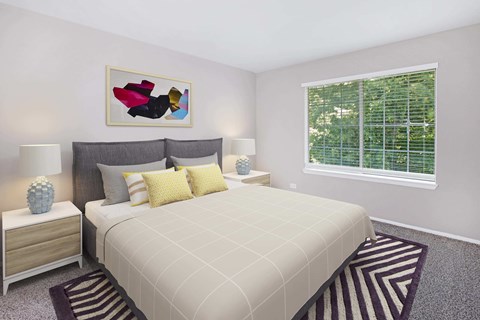A bedroom with a large bed and a painting above it.
