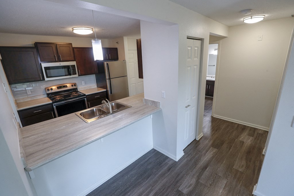 a view of a kitchen and living room in an apartment