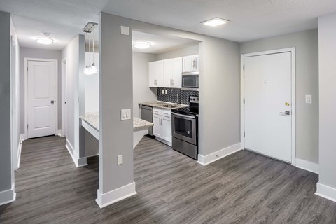 A kitchen with a stove top oven and a microwave.