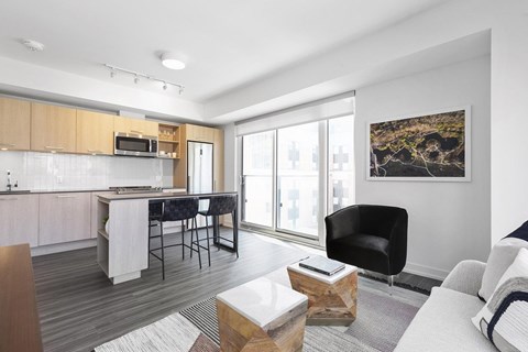 A modern kitchen with a dining table and chairs.