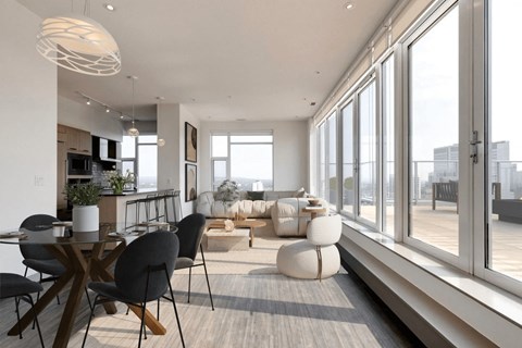 A modern living room with a dining table and chairs.