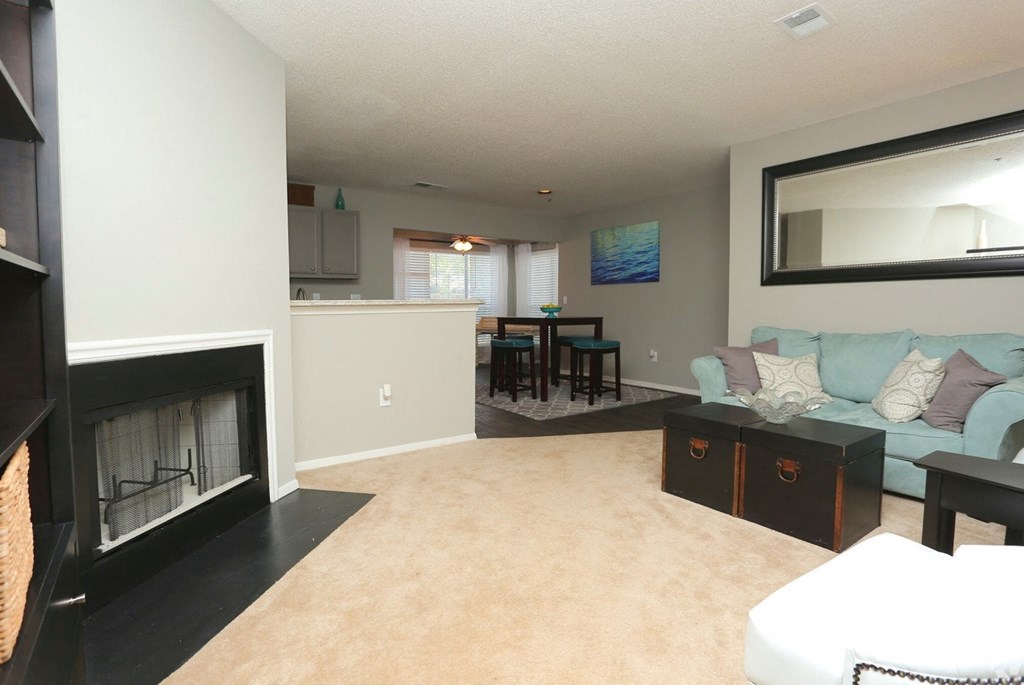 a living room with a couch and a fireplace