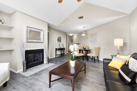 A living room with a fireplace and a couch.