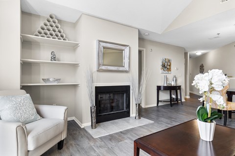 A living room with a fireplace and a couch.