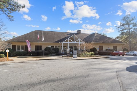 A building with a flag on a pole in front of it.