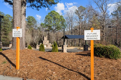 Two signs on poles that say Future Resident Parking.