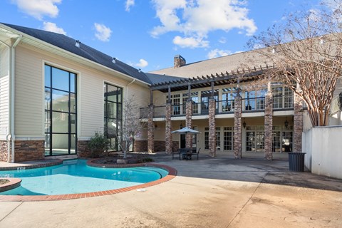 A house with a pool in the backyard.