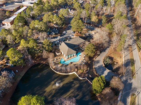A bird's eye view of a house with a pool in the backyard.