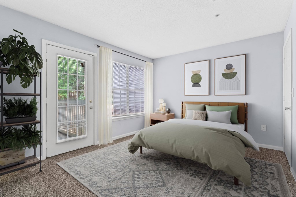 a bedroom with a bed and two windows