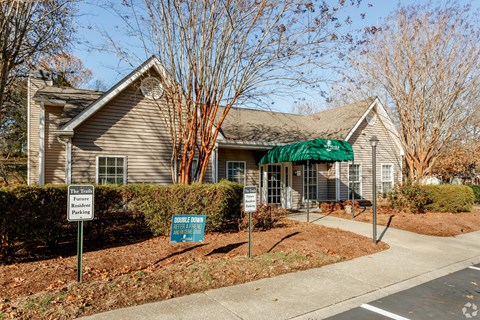 A house with a sign that says "No Parking" in front of it.
