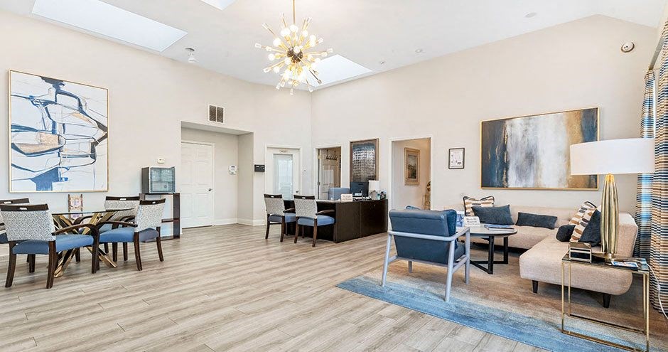a living room with a table and chairs
