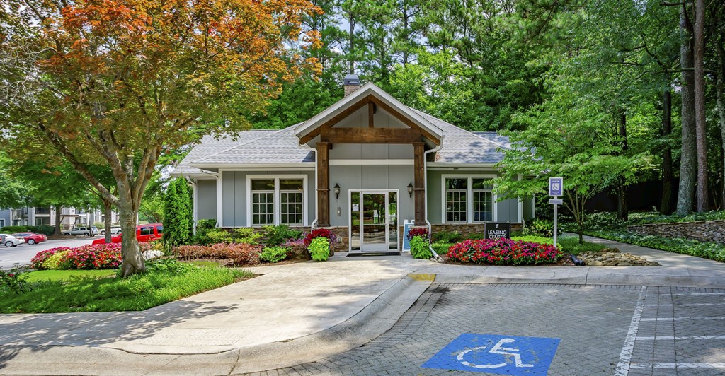 a house with a handicapped parking sign in front of it