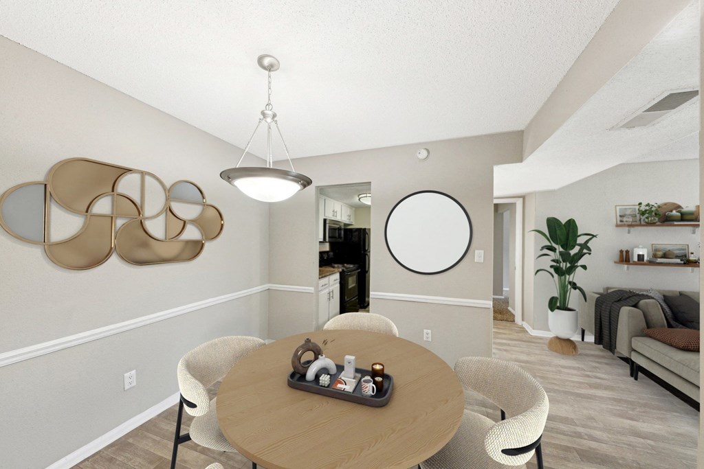 an open living room and dining room with a table and chairs