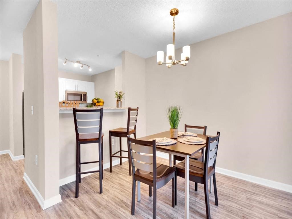 a dining room with a table and chairs
