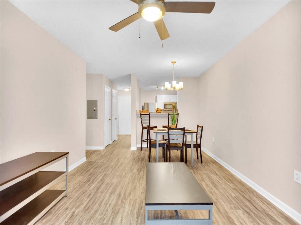 our apartments offer a living room and dining room with a ceiling fan