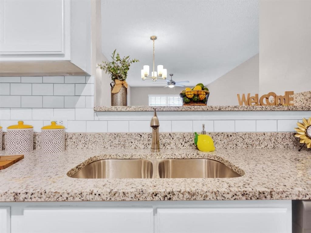 a kitchen with a sink and a counter top