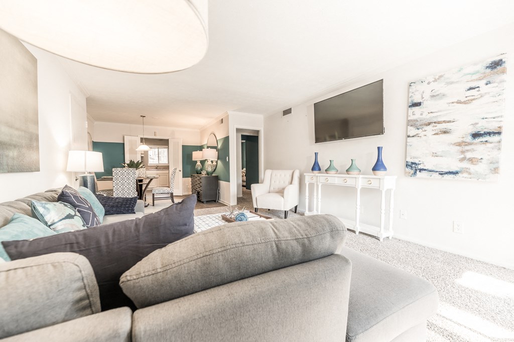 a living room with a couch and a tv