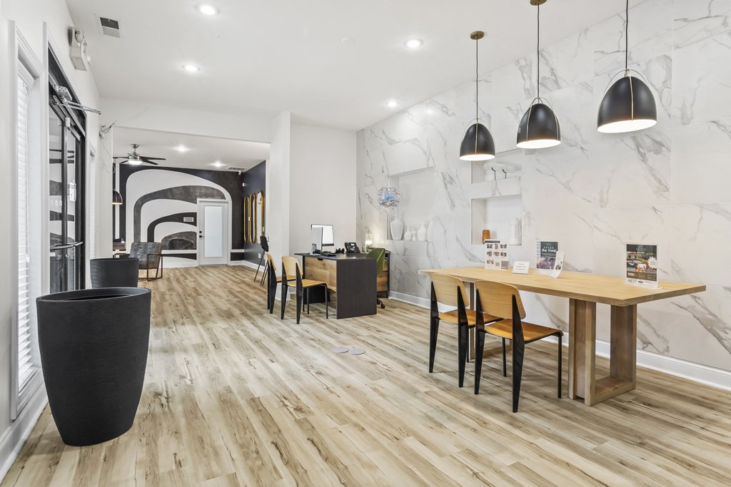 a living room and dining room with a table and chairs