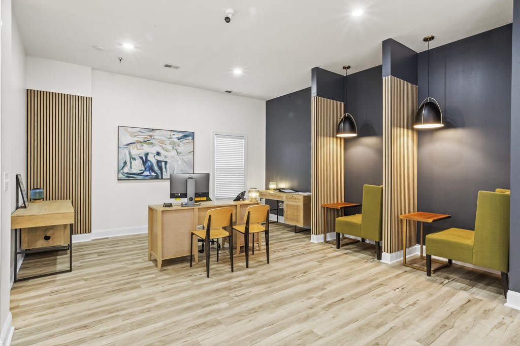 a conference room with desks and chairs and a tv