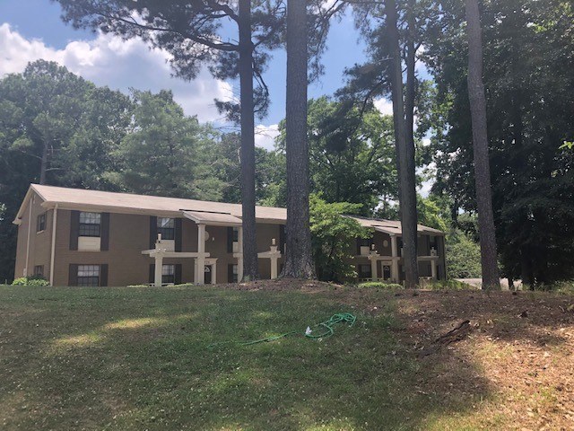 A building is surrounded by trees.