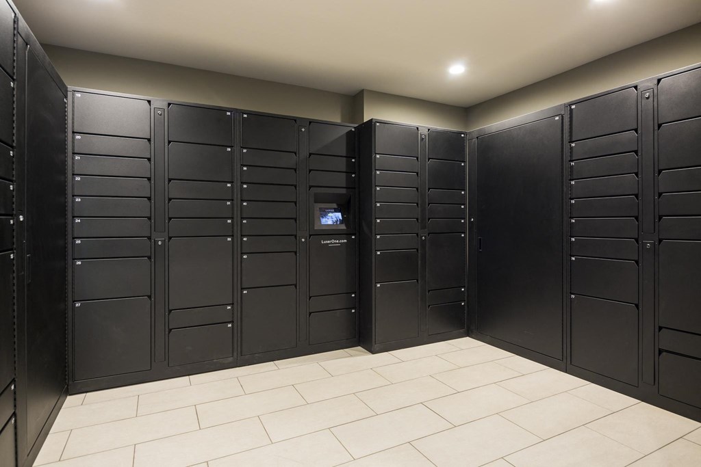 a hackerspace with black lockers and a white tile floor