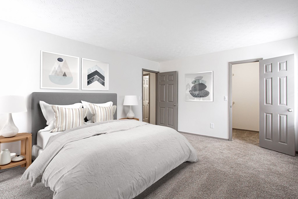 a bedroom with a bed and a closet