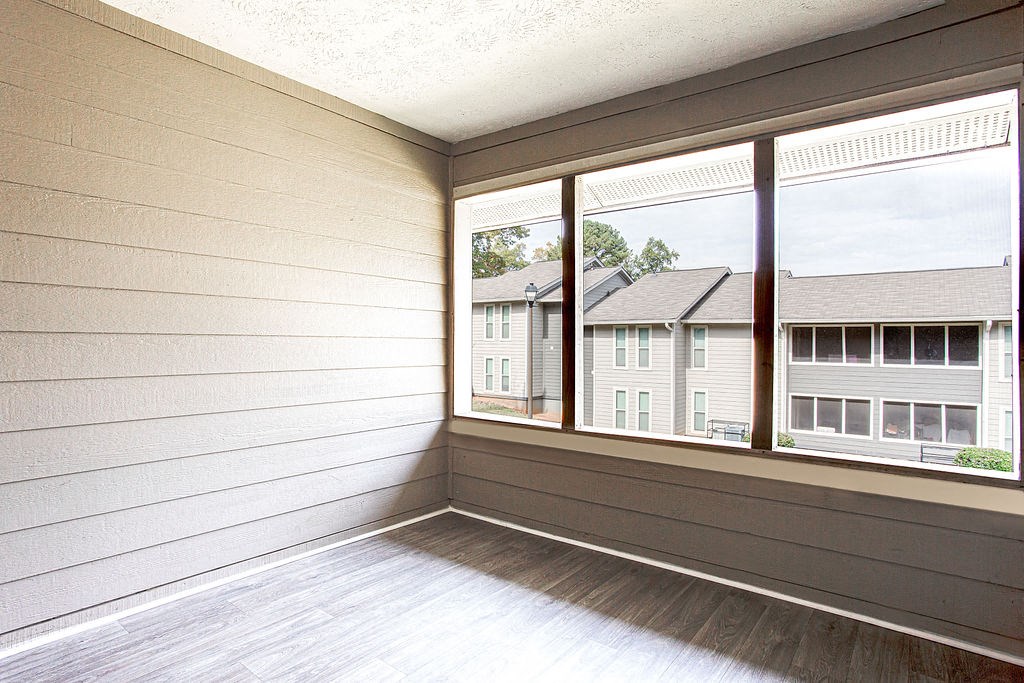the living room of a home with large windows