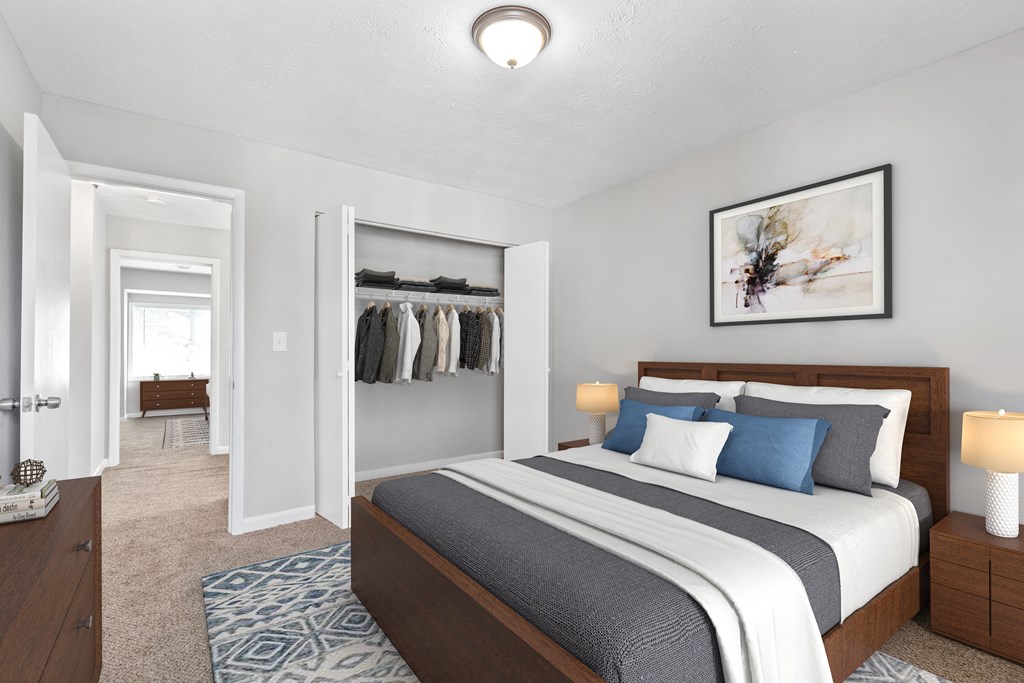 a bedroom with a bed and a closet