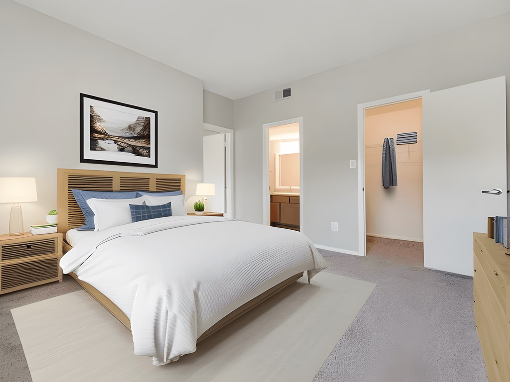 A bedroom with a large bed and a painting above it.