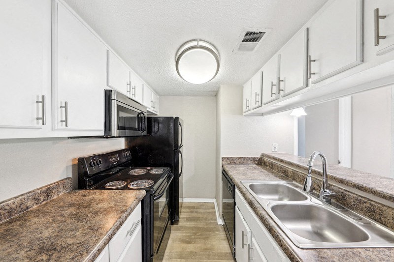 the spacious kitchen with granite counter tops and stainless steel appliances