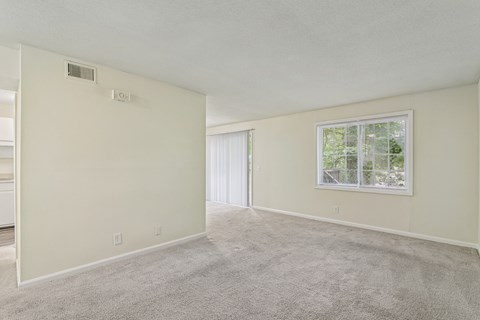 A room with a window and a door.