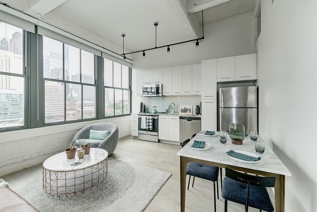 A modern kitchen with a dining table and chairs. A modern kitchen with a dining table and chairs.at 1600 Callowhill, Philadelphia Pennsylvania