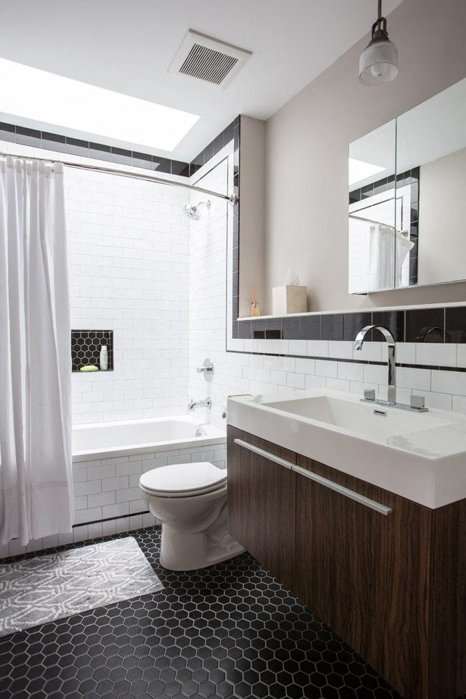 a bathroom with a toilet and a sink and a mirror