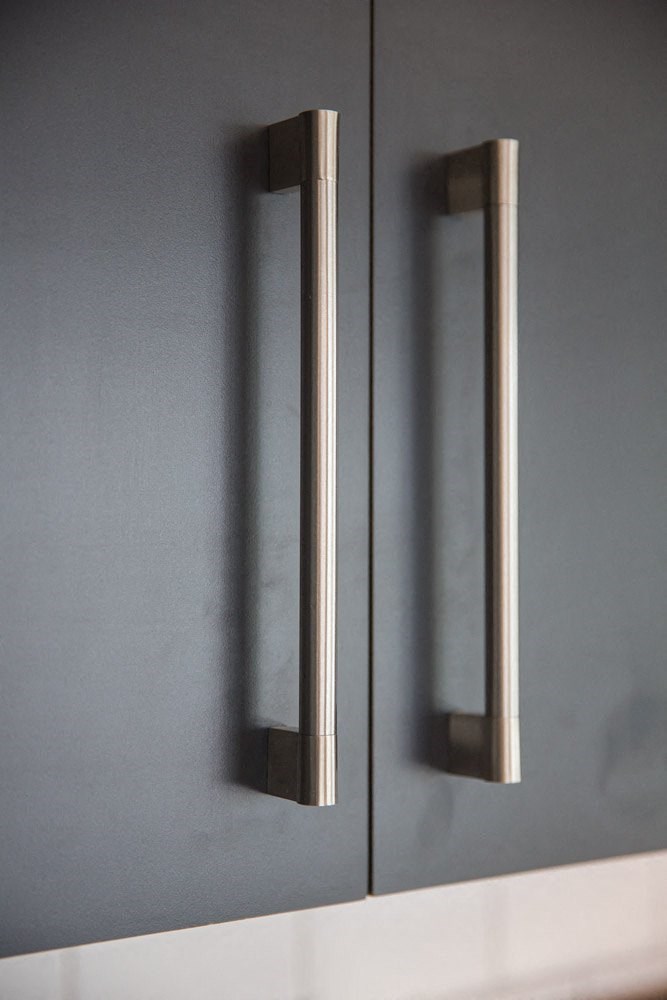 a bathroom with two mirrors on the wall