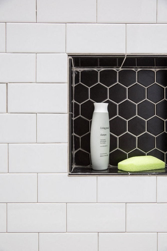 a white vase is sitting in a window