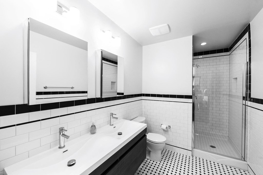 a bathroom with a sink toilet and a shower