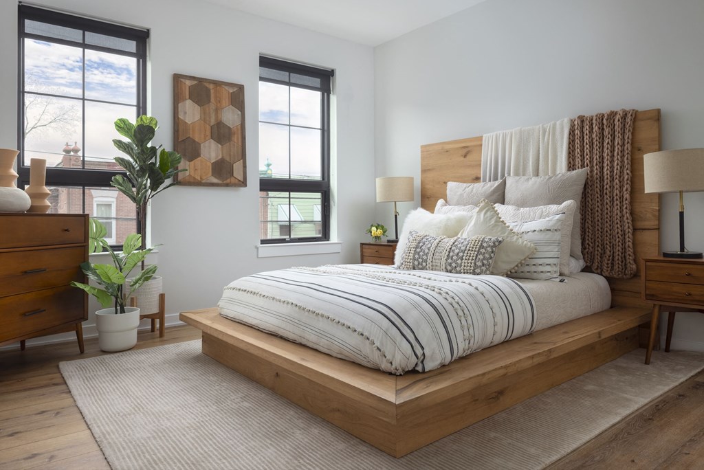 a bedroom with a bed and pillows on it