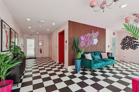 A living room with a black and white checkered floor.