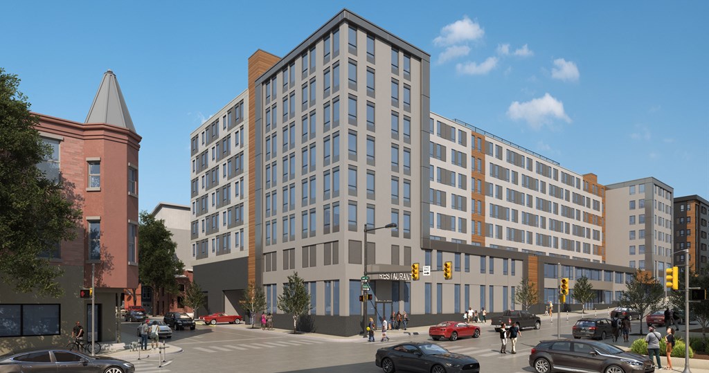 An artist’s rendering of the LVL West building exterior on the corner of 43rd and Chestnut Street. The building’s exterior features a modern design with predominantly gray tones and some orange detailing.