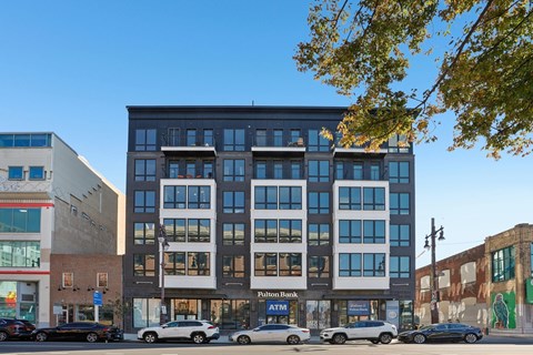 A multi-story building with a Putnam Bank branch in front.